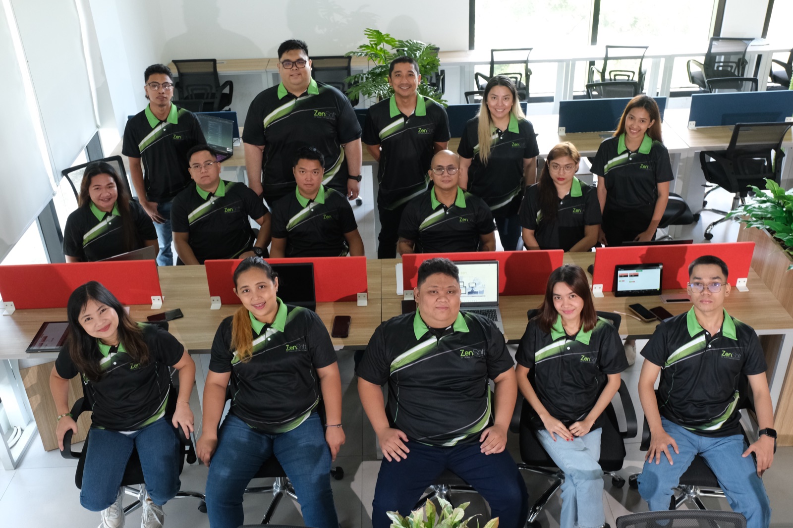 The ZenSoft team gathered at their desks in the Cainta office